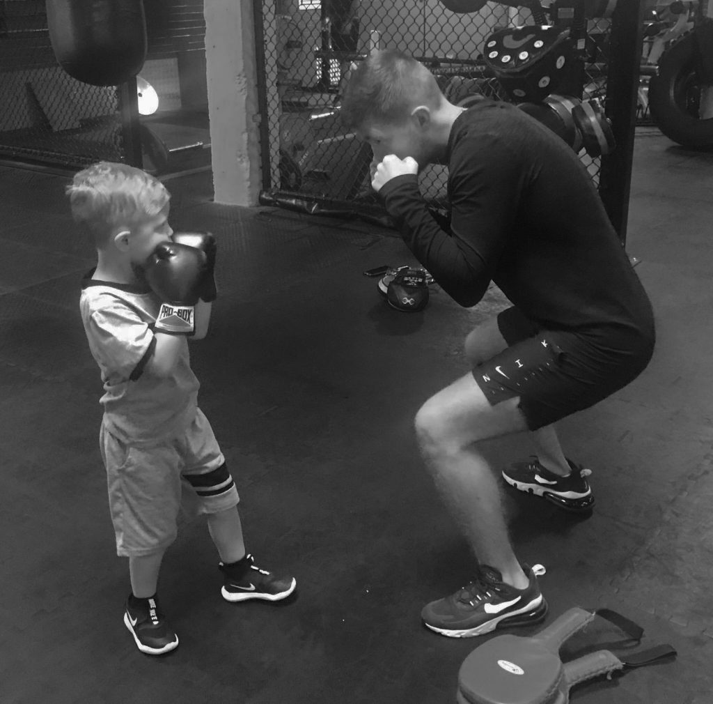 Charlie training a junior boxer